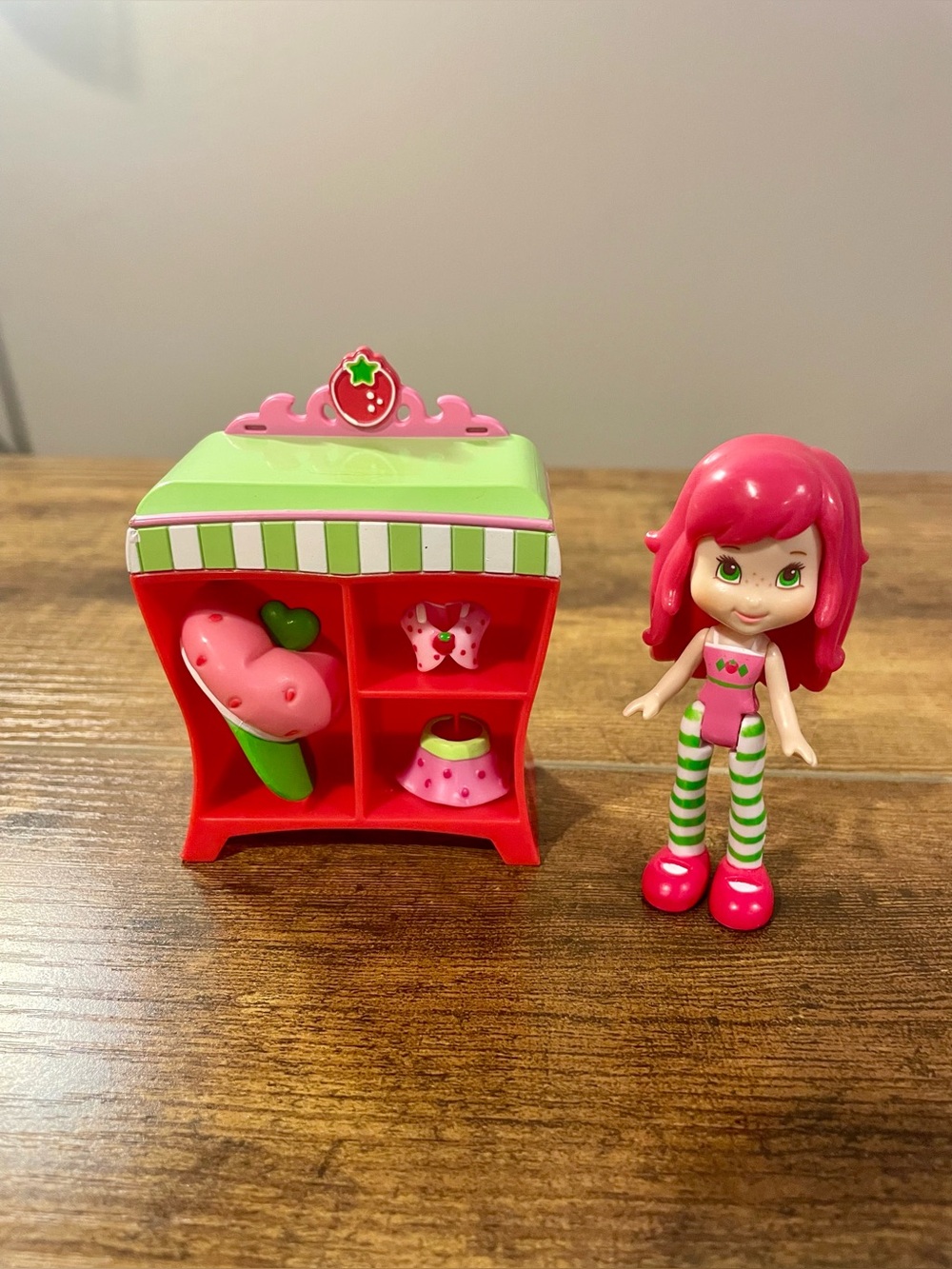 Strawberry Shortcake doll and a mini wardrobe closet